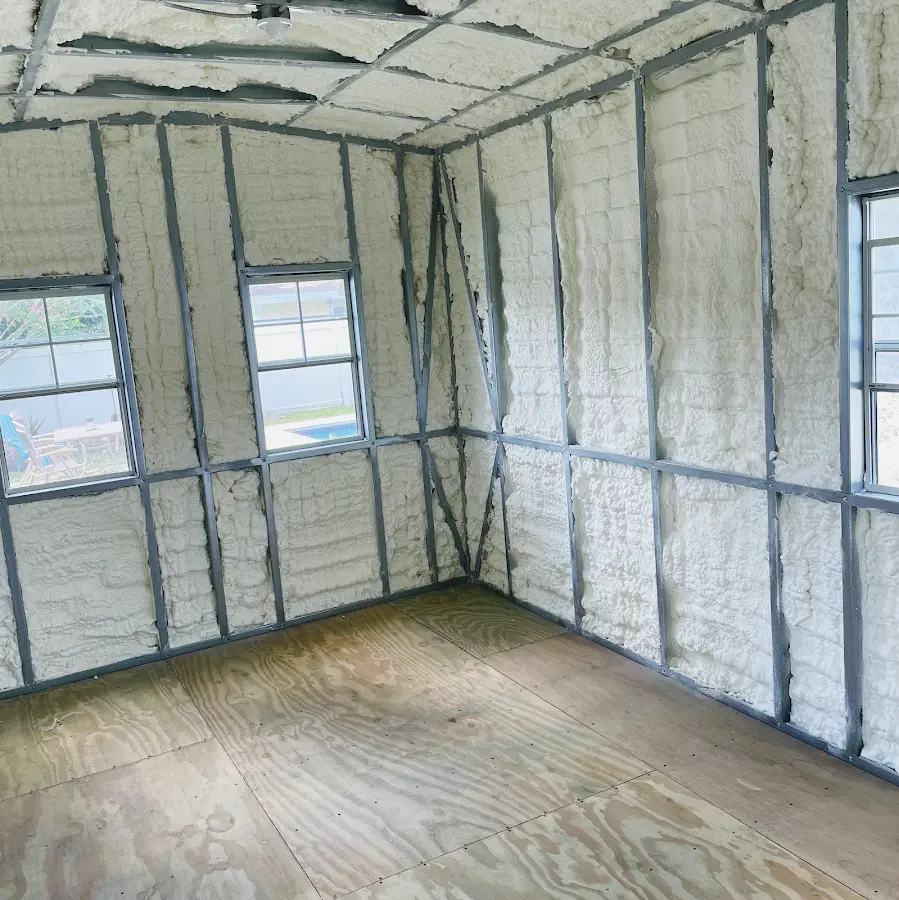 Closed-cell spray foam insulation applied to wall cavities in a residential project in Bernardsville